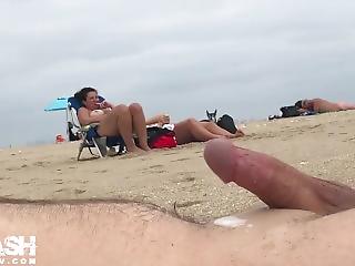 Bdsm shaved handjob cock on beach