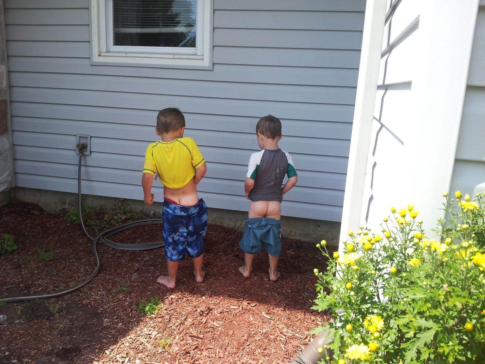 Boys peeing together