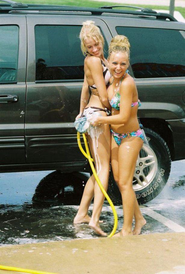 Amateur washing car in a bikini